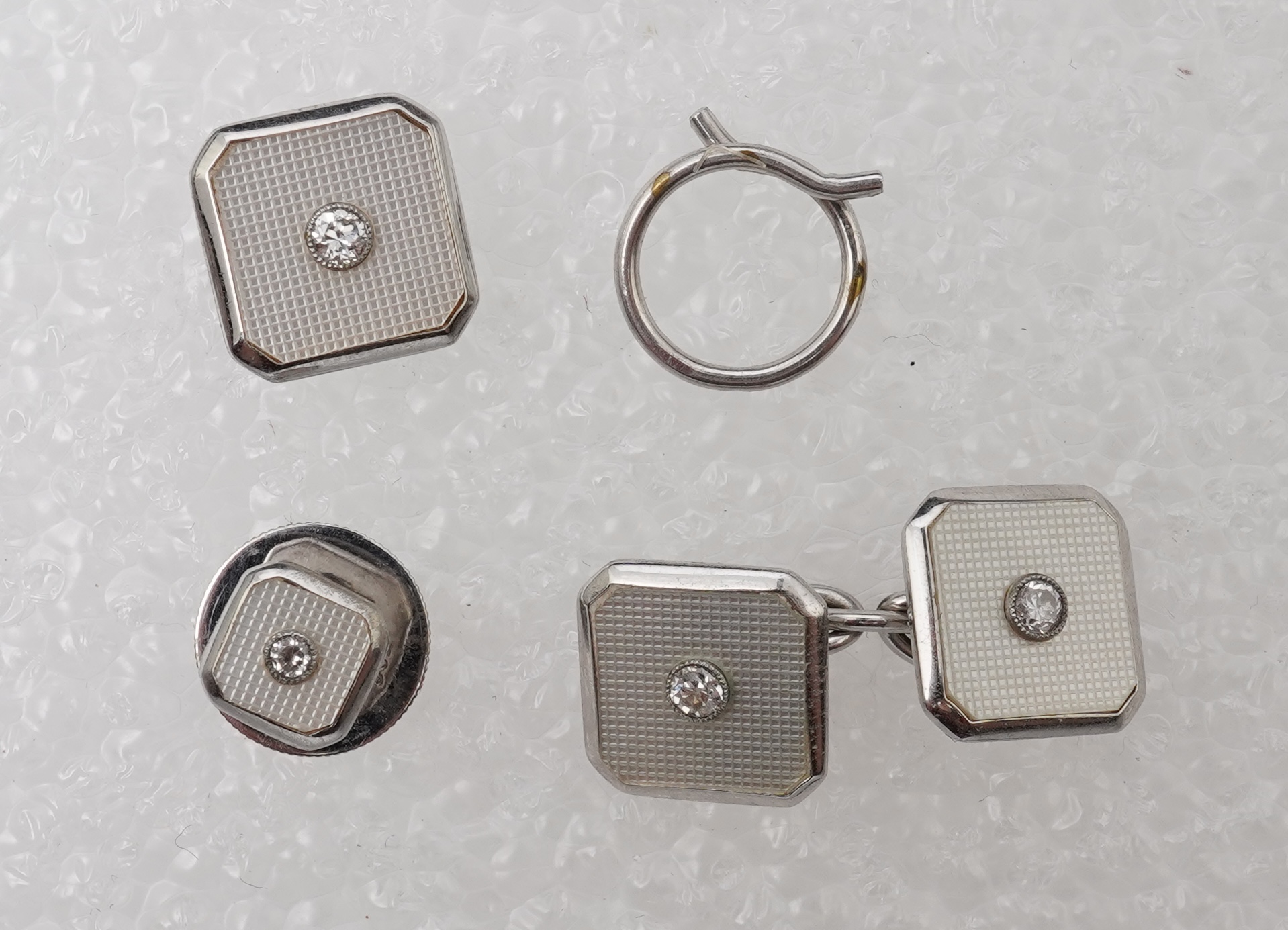 An Art Deco mother of pearl and diamond dress set, circa 1930